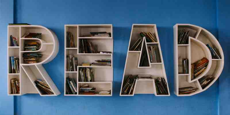 The word 'READ' spelled out as a bookshelf