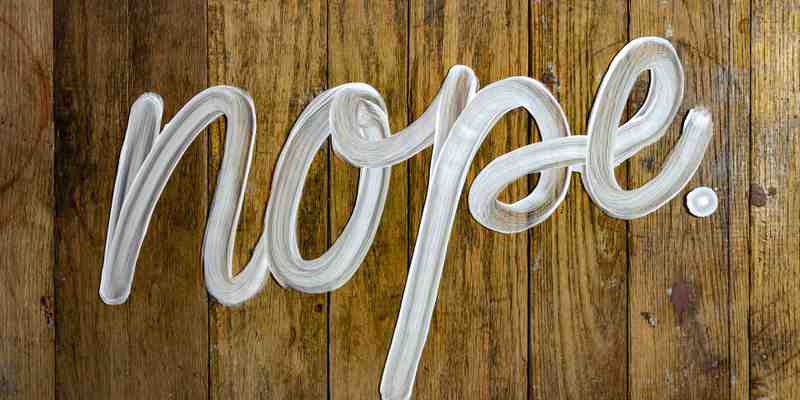 Nope written in paint on wood