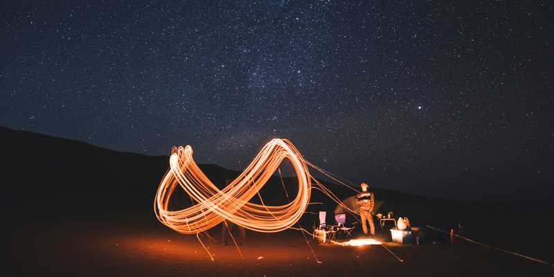 Light trail in the form of the infinity sign